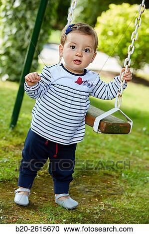 Baby playing in the park. Getaria. Gipuzkoa. Basque Country. Spain View Large Photo Image Stock Image - Baby playing in the park. Getaria. Gipuzkoa. Basque Country. Spain. Fotosearch