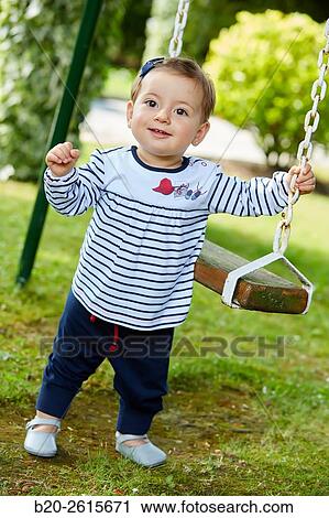 Baby playing in the park. Getaria. Gipuzkoa. Basque Country. Spain View Large Photo Image Stock Image - Baby playing in the park. Getaria. Gipuzkoa. Basque Country. Spain. Fotosearch