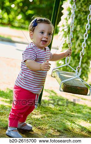 Baby playing in the park. Getaria. Gipuzkoa. Basque Country. Spain View Large Photo Image Stock Image - Baby playing in the park. Getaria. Gipuzkoa. Basque Country. Spain. Fotosearch