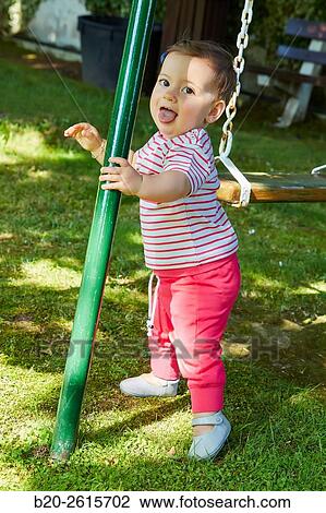 Baby playing in the park. Getaria. Gipuzkoa. Basque Country. Spain View Large Photo Image Stock Image - Baby playing in the park. Getaria. Gipuzkoa. Basque Country. Spain. Fotosearch