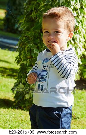 Stock Image - Baby playing in the park. Getaria. Gipuzkoa. Basque Country. Spain. Fotosearch