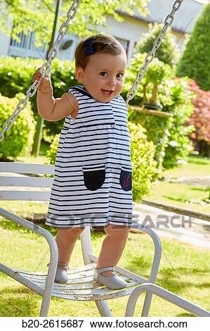 Baby playing in the park. Getaria. Gipuzkoa. Basque Country. Spain View Large Photo Image Stock Photo - Baby playing in the park. Getaria. Gipuzkoa. Basque Country. Spain. Fotosearch