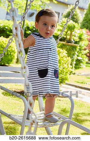 Baby playing in the park. Getaria. Gipuzkoa. Basque Country. Spain View Large Photo Image Stock Photo - Baby playing in the park. Getaria. Gipuzkoa. Basque Country. Spain. Fotosearch