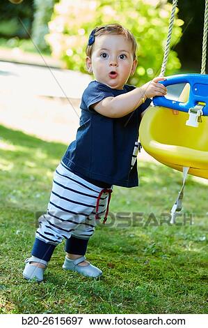 Baby playing in the park. Getaria. Gipuzkoa. Basque Country. Spain View Large Photo Image Stock Photo - Baby playing in the park. Getaria. Gipuzkoa. Basque Country. Spain. Fotosearch