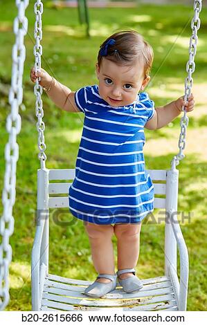 Baby playing in the park. Getaria. Gipuzkoa. Basque Country. Spain View Large Photo Image Stock Photograph - Baby playing in the park. Getaria. Gipuzkoa. Basque Country. Spain. Fotosearch