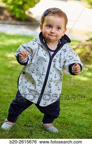 Baby playing in the park. Getaria. Gipuzkoa. Basque Country. Spain View Large Photo Image Stock Photograph - Baby playing in the park. Getaria. Gipuzkoa. Basque Country. Spain. Fotosearch
