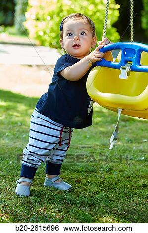 Baby playing in the park. Getaria. Gipuzkoa. Basque Country. Spain View Large Photo Image Stock Photograph - Baby playing in the park. Getaria. Gipuzkoa. Basque Country. Spain. Fotosearch