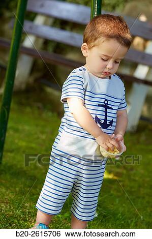 Baby playing in the park. Getaria. Gipuzkoa. Basque Country. Spain View Large Photo Image Stock Photograph - Baby playing in the park. Getaria. Gipuzkoa. Basque Country. Spain. Fotosearch