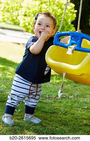 Baby playing in the park. Getaria. Gipuzkoa. Basque Country. Spain View Large Photo Image Stock Photography - Baby playing in the park. Getaria. Gipuzkoa. Basque Country. Spain. Fotosearch