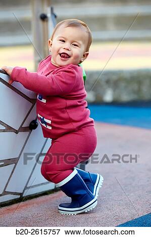 Baby playing in the park. Zumaia. Gipuzkoa. Basque Country. Spain View Large Photo Image Stock Photo - Baby playing in the park. Zumaia. Gipuzkoa. Basque Country. Spain. Fotosearch