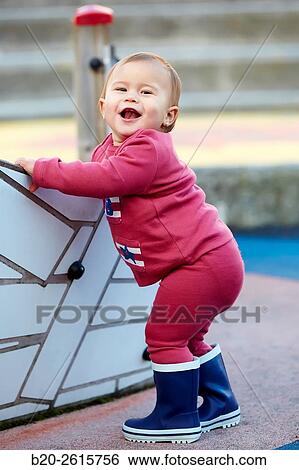 Stock Photograph - Baby playing in the park. Zumaia. Gipuzkoa. Basque Country. Spain. Fotosearch