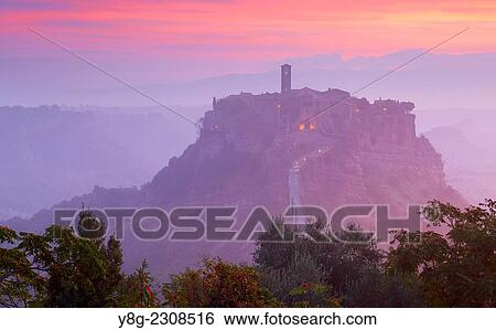Bagnoregio at sunrise, Italy. View Large Photo Image Stock Photograph - Bagnoregio at sunrise, Italy.. Fotosearch