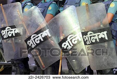 Bangladeshi police person stand guard in front of Bangladesh Nationalist Party (BNP) head office, during a nationwide strike called by the opposition Bangladesh Nationalist Party (BNP) in Dhaka on October 28, 2013. Three people were killed in nationwide c View Large Photo Image Stock Image - Bangladeshi police person stand guard in front of Bangladesh Nationalist Party (BNP) head office, during a nationwide strike called by the opposition Bangladesh Nationalist Party (BNP) in Dhaka on October 28, 2013. Three people were killed in nationwide c. Fotosearch
