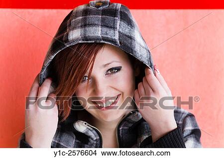 Picture - Beautiful Teen girl portrait under hood is very happy. Fotosearch