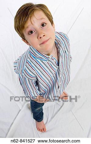 Bewildered child with hands in pocket View Large Photo Image Stock Photo - Bewildered child with hands in pocket. Fotosearch