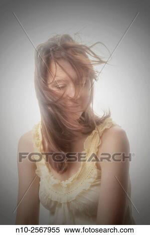 Blowing hair on a young woman. View Large Photo Image Stock Photography - Blowing hair on a young woman.. Fotosearch