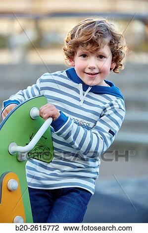 Stock Image - Boy playing in the park. Zumaia. Gipuzkoa. Basque Country. Spain. Fotosearch