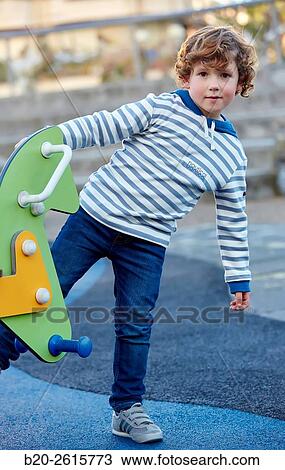 Boy playing in the park. Zumaia. Gipuzkoa. Basque Country. Spain View Large Photo Image Stock Image - Boy playing in the park. Zumaia. Gipuzkoa. Basque Country. Spain. Fotosearch