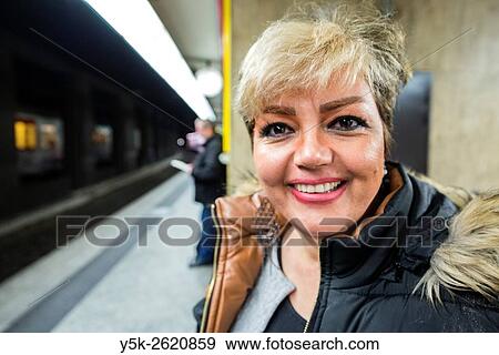 Brussels, Belgium. Blonde Iranian woman waiting for her International train on Brussels Central Station. View Large Photo Image Stock Photo - Brussels, Belgium. Blonde Iranian woman waiting for her International train on Brussels Central Station.. Fotosearch