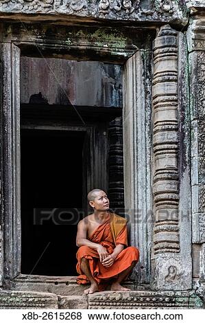 Buddhist monk in Prasat Bayon, Angkor Thom, Angkor, Siem Reap Province, Cambodia, Khmer. View Large Photo Image Stock Photo - Buddhist monk in Prasat Bayon, Angkor Thom, Angkor, Siem Reap Province, Cambodia, Khmer.. Fotosearch