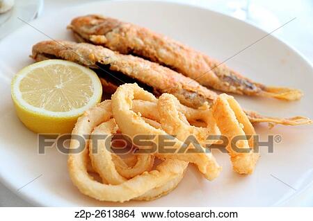 Calamari rings and fish on plate. View Large Photo Image Picture - Calamari rings and fish on plate.. Fotosearch