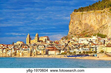 Picture - Cefalu old town with cathedral and La Rocca hill, Cefalu (Cefa) Sicily, Italy.. Fotosearch