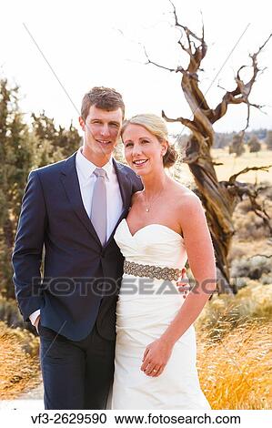 Central Oregon wedding day portrait of the bride and groom outdoors in the Winter. View Large Photo Image Stock Image - Central Oregon wedding day portrait of the bride and groom outdoors in the Winter.. Fotosearch