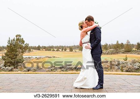 Central Oregon wedding day portrait of the bride and groom outdoors in the Winter. View Large Photo Image Stock Image - Central Oregon wedding day portrait of the bride and groom outdoors in the Winter.. Fotosearch