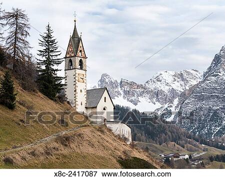 Chapel Barbarakapelle in the village of Wengen (la Valle), in the Valley Gadertal (Alta Badia) in South Tyrol. Mount Heiligkreuzkofel in the background. Europe, Central Europe, South Tyrol, Italy. View Large Photo Image Stock Photo - Chapel Barbarakapelle in the village of Wengen (la Valle), in the Valley Gadertal (Alta Badia) in South Tyrol. Mount Heiligkreuzkofel in the background. Europe, Central Europe, South Tyrol, Italy.. Fotosearch