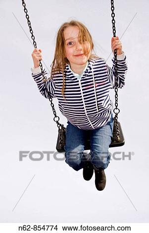 Child on the playground swing View Large Photo Image Picture - Child on the playground swing. Fotosearch
