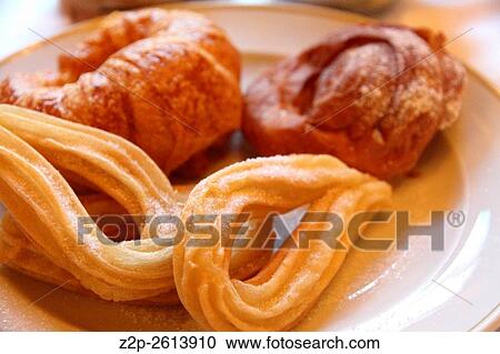 Churros and croissant on plate breakfast. View Large Photo Image Stock Image - Churros and croissant on plate breakfast.. Fotosearch