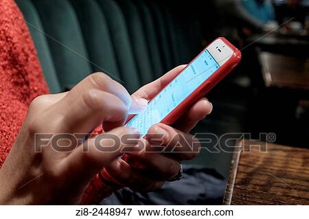 Close-up of woman organising her diary on smart phone. View Large Photo Image Stock Photo - Close-up of woman organising her diary on smart phone.. Fotosearch