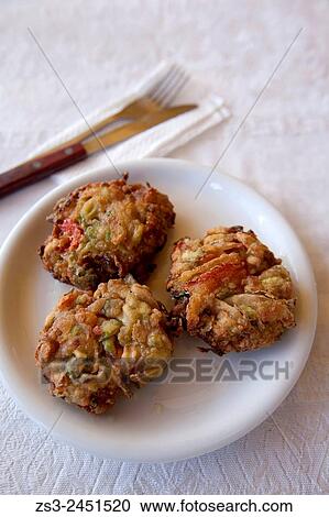 Close-Up shot of Zucchini Fritters in the mountain village of Meronas, Rethymno Region, Crete, Greek Islands, Greece, Europe. View Large Photo Image Stock Image - Close-Up shot of Zucchini Fritters in the mountain village of Meronas, Rethymno Region, Crete, Greek Islands, Greece, Europe.. Fotosearch
