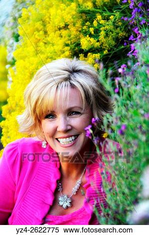 Closeup of a woman outdoors in a garden in Spokane, Washington, USA. View Large Photo Image Stock Photography - Closeup of a woman outdoors in a garden in Spokane, Washington, USA.. Fotosearch