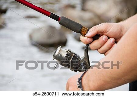 Closeup of a young man fishing in the Spokane River, Washington State. View Large Photo Image Stock Image - Closeup of a young man fishing in the Spokane River, Washington State.. Fotosearch