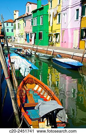Colored Fishing boats, canal, Drying clothes, colored facades, Burano island, Venice, Venetia, Italy. View Large Photo Image Stock Image - Colored Fishing boats, canal, Drying clothes, colored facades, Burano island, Venice, Venetia, Italy.. Fotosearch