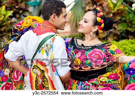 Colorful Mexican costumes - Puerto Vallarta, Jalisco, Mexico. Xiutla Dancers - a folkloristic Mexican dance group in traditional costumes representing the culture and different regions of Mexico. View Large Photo Image Picture - Colorful Mexican costumes - Puerto Vallarta, Jalisco, Mexico. Xiutla Dancers - a folkloristic Mexican dance group in traditional costumes representing the culture and different regions of Mexico.. Fotosearch