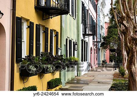Colorful pastel building facades on Rainbow Row along East Bay Street in historic Charleston, SC. View Large Photo Image Picture - Colorful pastel building facades on Rainbow Row along East Bay Street in historic Charleston, SC.. Fotosearch