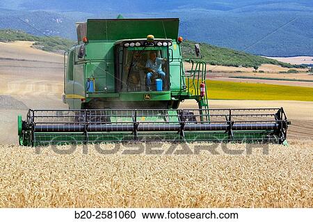 Stock Image - Combine cereal. Agricultural machinery Combine harvester on field of wheat? Learza? estate Near Estella, Navarre, Spain. Fotosearch