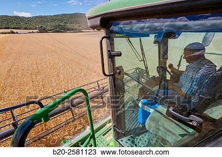 Combine cereal. Agricultural machinery Combine harvester on field of wheat? Learza? estate Near Estella, Navarre, Spain View Large Photo Image Stock Image - Combine cereal. Agricultural machinery Combine harvester on field of wheat? Learza? estate Near Estella, Navarre, Spain. Fotosearch