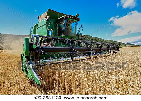 Stock Image - Combine cereal. Agricultural machinery Combine harvester on field of wheat? Learza? estate Near Estella, Navarre, Spain. Fotosearch