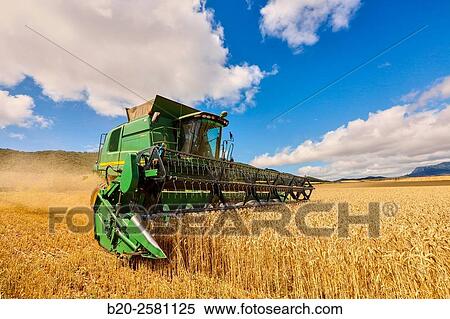 Stock Photography - Combine cereal. Agricultural machinery Combine harvester on field of wheat? Learza? estate Near Estella, Navarre, Spain. Fotosearch
