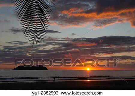 Costa Rica. Pacific coast, Puntarenas province, Manuel Antonio, Playa Espadilla beach at sunset, back islas Gemelas, Latin America View Large Photo Image Stock Image - Costa Rica. Pacific coast, Puntarenas province, Manuel Antonio, Playa Espadilla beach at sunset, back islas Gemelas, Latin America. Fotosearch