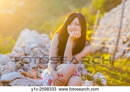 Country-girl under late-day sunset light View Large Photo Image Stock Image - Country-girl under late-day sunset light. Fotosearch