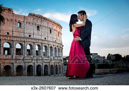 Couple at colosseum. Rome. Italy. View Large Photo Image Stock Photo - Couple at colosseum. Rome. Italy.. Fotosearch