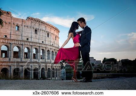 Couple at colosseum. Rome. Italy. View Large Photo Image Stock Photograph - Couple at colosseum. Rome. Italy.. Fotosearch
