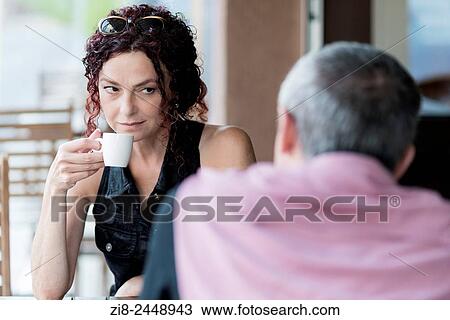Stock Image - Couple in a coffee shop.. Fotosearch