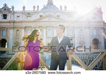 Couple in front of Saint Peters basilica. Vatican, Rome, Italy. View Large Photo Image Stock Image - Couple in front of Saint Peters basilica. Vatican, Rome, Italy.. Fotosearch