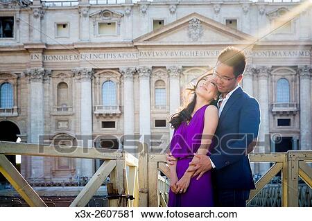 Couple in front of Saint Peters basilica. Vatican, Rome, Italy. View Large Photo Image Stock Image - Couple in front of Saint Peters basilica. Vatican, Rome, Italy.. Fotosearch