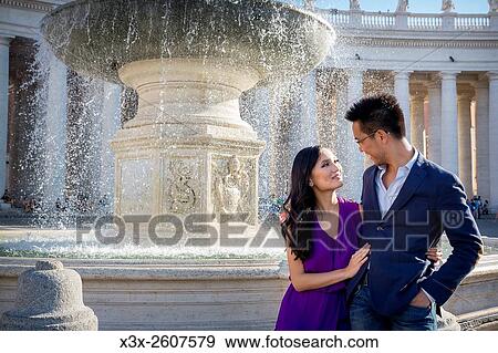 Couple in Piazza San Pietro with fountain. Rome. Italy. View Large Photo Image Stock Photo - Couple in Piazza San Pietro with fountain. Rome. Italy.. Fotosearch
